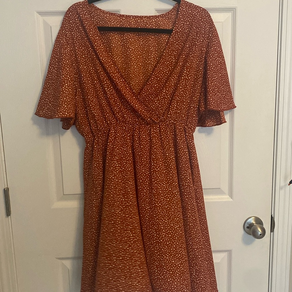 Orangeish red polka dot dress.
